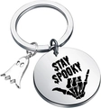 Detailed close-up of stainless steel Stay Spooky keychain with ghost charm and skull hand - Stay Spooky Skeleton Hand Ghost Style