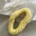 Sweet cream colored plush hair claw clip in soft fleece material for messy bun hairstyle - Yellow