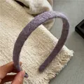 Close-up detail of purple mohair knitted headband showing soft fuzzy fiber texture - Purple