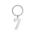 Close-up of polished stainless steel number 7 pendant attached to a silver keychain ring - Number 7