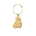 Détail d'un porte-clés capybara doré en métal poli avec une découpe en forme de cœur - Capybara Doré Style A