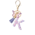 Letter K resin keychain with purple star glitter, butterfly pendant and lavender tassel - Purple K