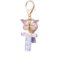 Purple resin letter T keychain with glitter butterfly and suede tassel pendant charm - Purple T