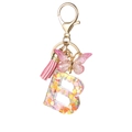 Pink resin letter B keychain with heart sequins, butterfly charm and silk tassel - Resin B
