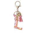 Pink resin letter L keychain with heart sequins, butterfly charm and pink tassel decoration - Resin L