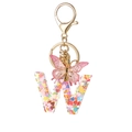 Pink heart glitter resin letter W keychain with butterfly pendant and gold lobster clasp - Resin W