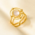 Detail of 18k gold plated ring with a round white shell inlay and textured border - Gold White Mother Of Pearl Style (J939-G-W)