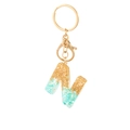 Letter N resin keychain with gold leaf and green stone flakes on a white background - Letter N Style