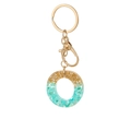 Letter O keychain pendant with gold foil and light blue stones in resin and gold plating - Letter O Style