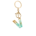 Golden resin letter V keychain with green stone fragments and gold foil accents - Style Letter V