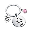 Detailed view of Libra zodiac keychain with pink birthstone and engraved heart pendant - Libra