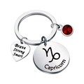 Detail of Capricorn stainless steel keychain with red birthstone and engraved heart charm - Capricorn