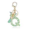 Detail of green resin letter Q keychain with glitter, butterfly, and mint tassel - Green Butterfly Q