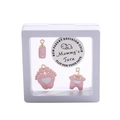 Pink enamel baby charm set with decision coin in a white floating display frame - Cartoon Baby Pink Style D