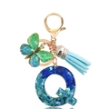 Detail of glitter blue resin letter Q keychain with gradient butterfly and blue tassel - Letter Q