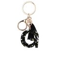 Black resin letter G keychain with colorful star sequins and black suede tassel - Letter G