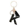 Letter K keychain with black resin, gold sequins and stylish black suede tassel - Letter K