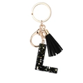 Black resin letter L keychain with golden star sequins and black decorative tassel - Letter L