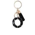 Fashionable black resin keyring with gold hardware, leather tassel and star sequins - Letter O