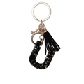 Letter U black resin keychain with gold glitter, stars and matching black tassel - Letter U