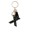 Black resin letter X keychain with gold stars, black tassel and gold lobster clasp - Letter X