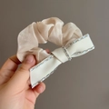 Sparkling rhinestone bow scrunchie in champagne satin fabric for elegant hairstyles - Champagne