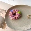 Detailed view of a pink plush spiral hair tie with a green pompom and colorful fiber spots - Pink Spiral Style (A-3317-5)