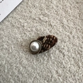 Detail of tweed hair clip featuring an elegant faux pearl button and woven fabric - Dark Coffee