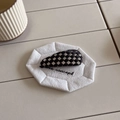 Detail view of woven checkerboard hair clip in black and silver on a white fabric pad - Teardrop / Black Teardrop (D-4150-4)
