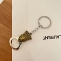 Kroon leeuwenkop flesopener sleutelhanger in vintage brons op een zachte achtergrond - Leeuwenkop Kroon Flesopener Stijl
