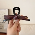Elegante pinza per capelli con fiocco in ecopelle bordeaux e nero e dettaglio dorato - Rosso