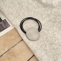 Detail of three-strand elastic hair tie featuring a matte brushed metal oval ornament - Brushed Round Plate / Silver Round