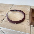 Close-up of a purple velvet headband featuring a handmade label and gold metal pendant - Wine Red (D-4843-3)