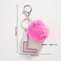 Spécifications de taille pour le porte-clés lettre L rose à pompon avec dimensions et poids - L