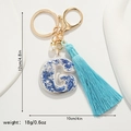 Blue and white porcelain letter G keychain with tassel and dimensions of 12x10cm - Letter G