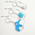 Set van drie schattige houten olifant sleutelhangers in roze en blauw, diverse maten - Olifantenfamilie Stijl