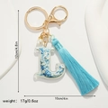 Detailed dimensions of letter L keychain with blue floral patterns and silk tassel - L