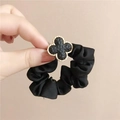 Black satin hair scrunchie with golden clover charm for elegant hairstyles - Hammered Texture Clover / Black
