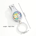 Detail of dragonfly nail clipper keychain showing size measurements and colorful art - Artistic Dragonfly (Style 7)