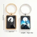 Dual howling wolf time gem rectangular keychains in gold and silver metal finishes - Style 1 Keychain