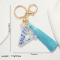Blue floral letter V keychain detail showing 12cm height and 10cm width dimensions - Letter V