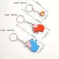 Vista dettagliata di tre portachiavi puzzle a scoiattolo con misure e peso specificati - Design Famiglia di Scoiattoli