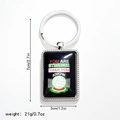 Detail view of volleyball metal keychain showing size markings and inspirational quote - Style 8 Keychain