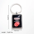 Gros plan d'un porte-clés métallique rectangulaire avec logo football et dimensions - Style 3 Porte-clés