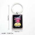 Macro view of rugby helmet metal keychain with inspirational quote and size measurements - Style 4 Keychain