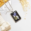Macro detail of baseball necklace showing athlete silhouette and motivational quote on black plate - Style 7 / Necklace