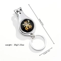 Close-up of a 3-in-1 silver nail clipper with bottle opener and letter M butterfly design - Letter M