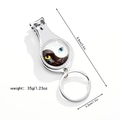 Detail of yin-yang cat eye nail clipper keychain showing sizes 8.8cm and 3.3cm - Black White Cat Eye Yin Yang (Style 2)