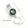 Close-up of silver metal 3-in-1 nail clipper keychain with dimensions 8.8x3.3cm - Letter V