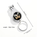 Macro detail of 3-in-1 multifunctional keychain with nail clipper and bottle opener - Letter X